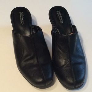 Black leather clogs